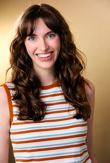 Abby Bryan in a striped top headshot